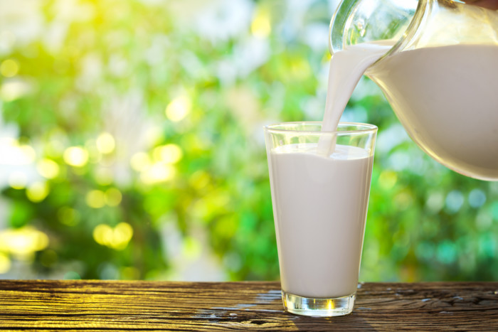 Pouring milk in the glass.