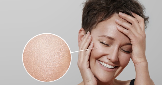 happy woman with a lens showing her ideal skin