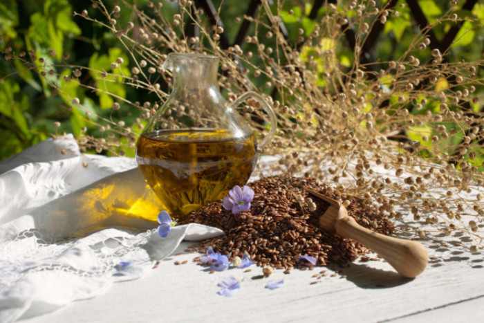 Linseed oil and seeds on a table