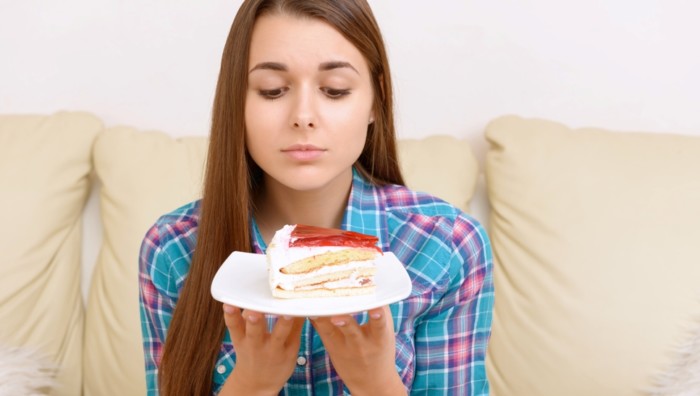 I want it. Girl wanting nice piece of tasty cake.