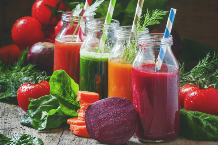 Freshly squeezed vegetable juice in bottles, useful vitamin cock