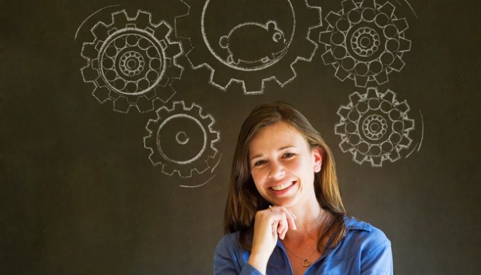 Thinking business woman with gear cogs and hamster